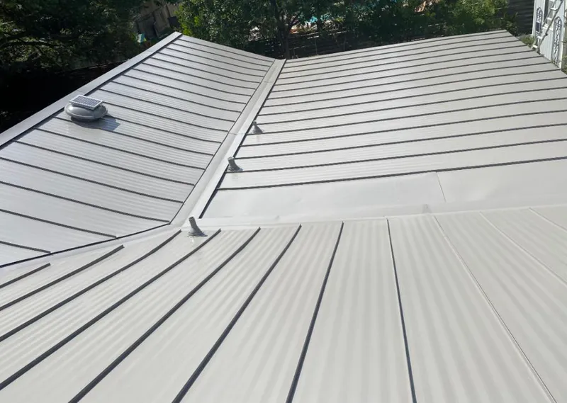 Solar attic fan installed on a metal roof for Roof Ventilation in West Memphis
